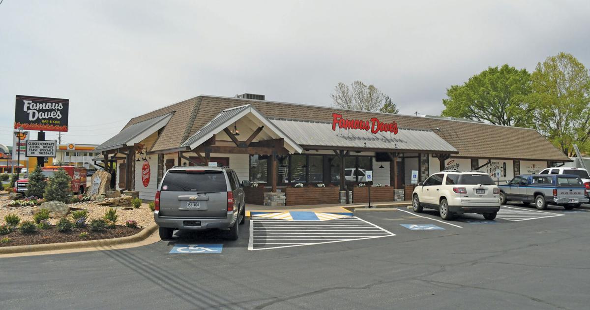 Exterior of a casual dining restaurant, with its name prominently displayed, set in a parking lot that suggests a welcoming and accessible location for diners.