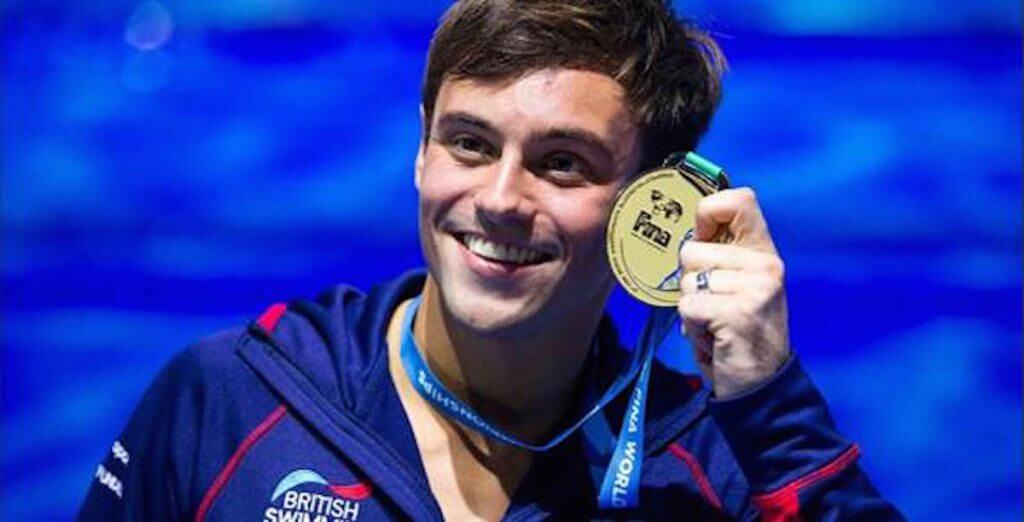 Tom Daley showing his medal