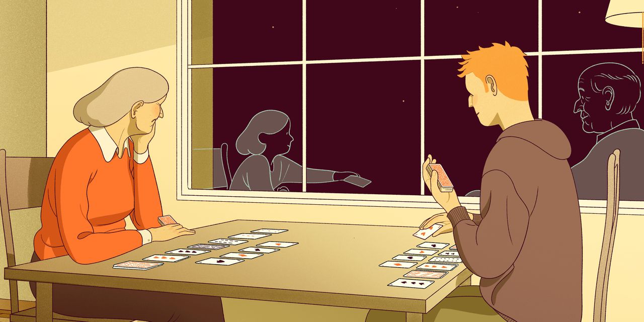 Two animated characters are playing cards at a table, with their reflections visible in the window behind them.
