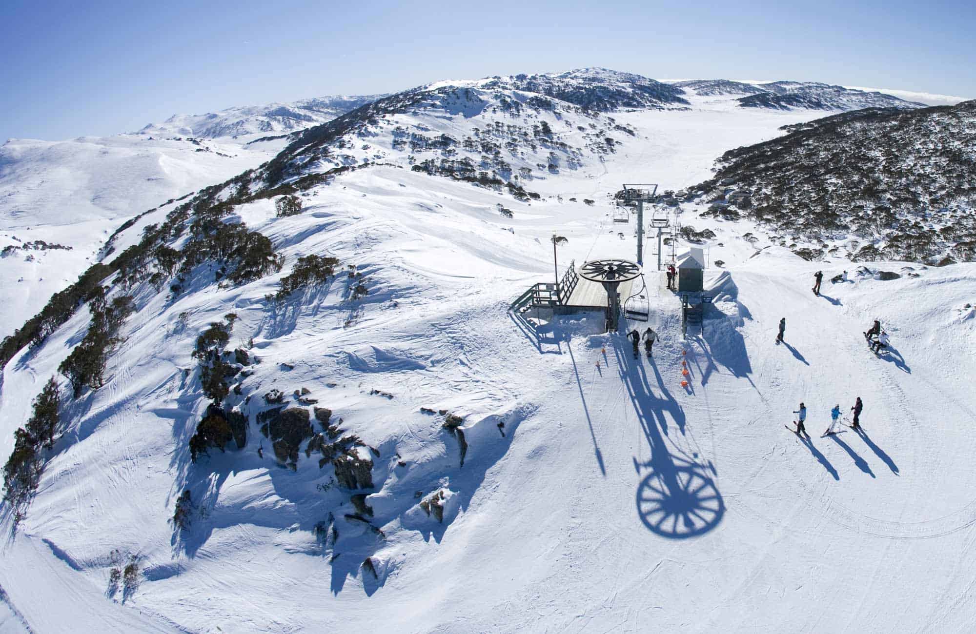 People skiing on mountain cover with snow in australia