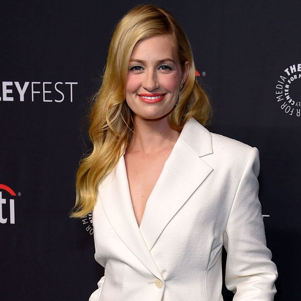 Beth Behrs wearing a white suit