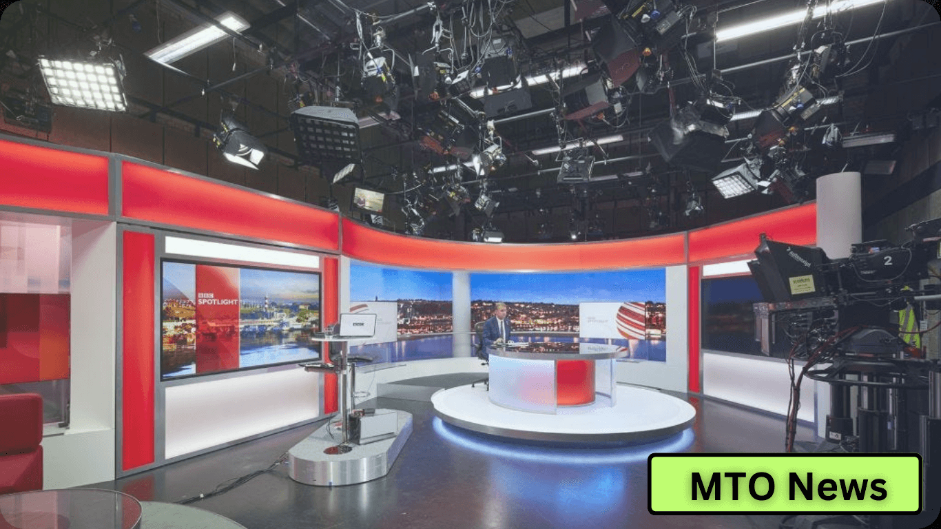 A modern news studio setup with multiple screens and cameras, ready for a broadcast, with "MTO News" indicated as the likely news outlet.