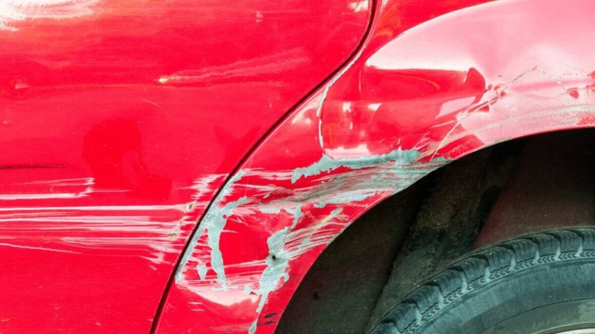 Primer scratch on a red car