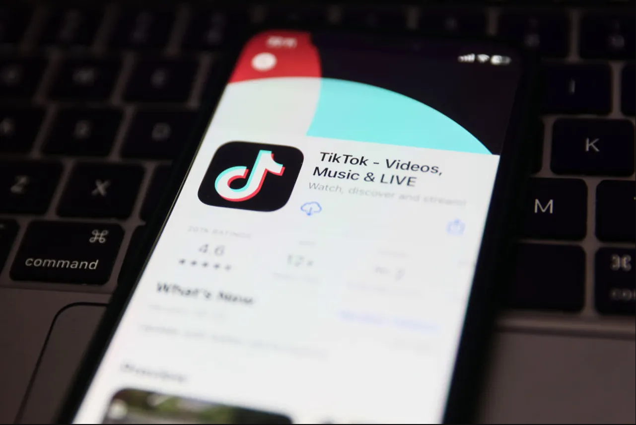 A close-up of a cell phone screen with the TikTok app on it