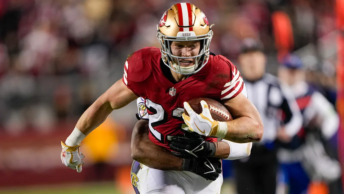 Christian McCaffrey #23 of the San Francisco 49ers runs the ball during the second quarter against the Baltimore Ravens at Levi's Stadium on December 25, 2023 in Santa Clara, California.