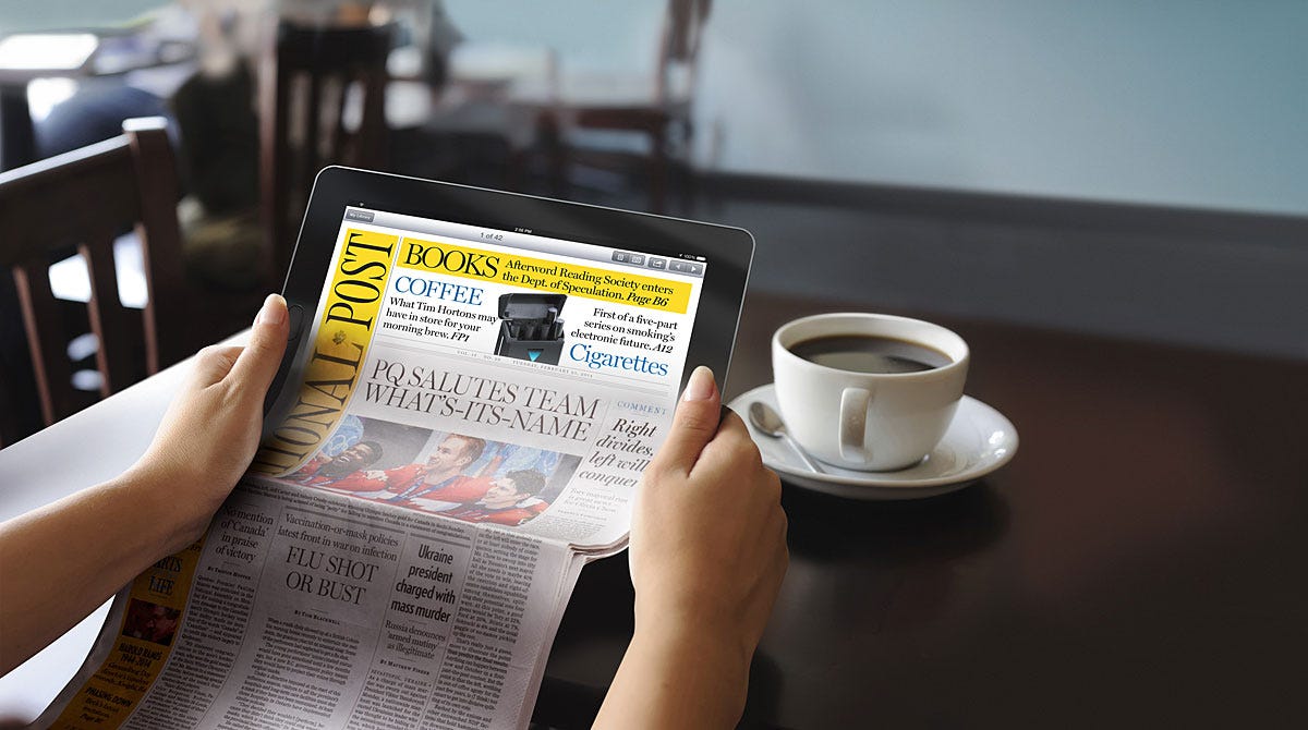 A person reading a newspaper on a tablet with a cup of coffee on the table, illustrating the modern way of consuming news digitally while maintaining a traditional setting.