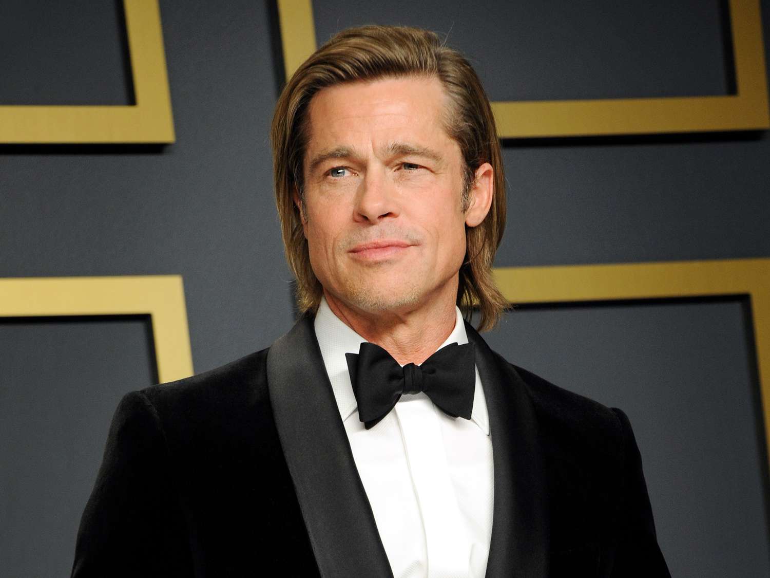 Brad Pitt wearing a black suit