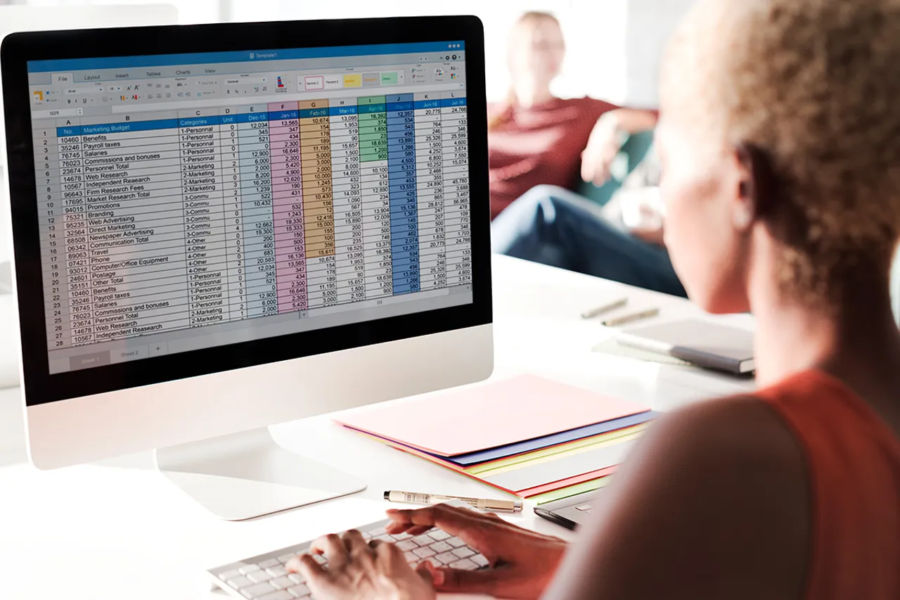 Excel spreadsheet on a desktop computer, indicative of data analysis or management tasks.