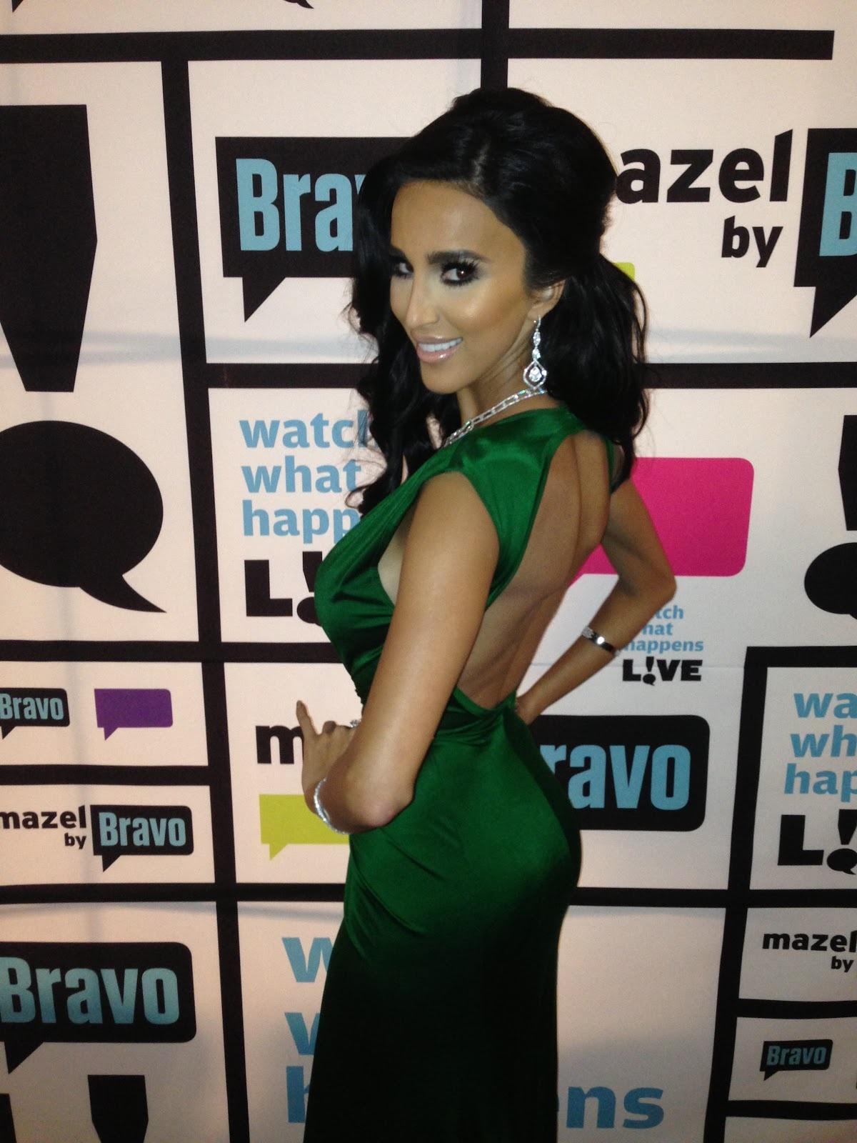 Lilly Ghalichi wearing a green dress