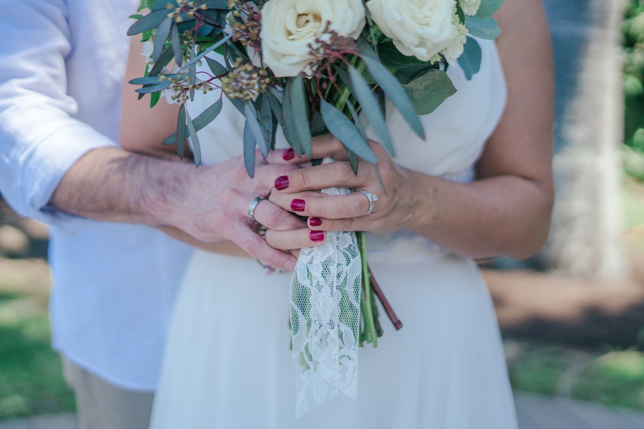 Woman Holding White Bouquet