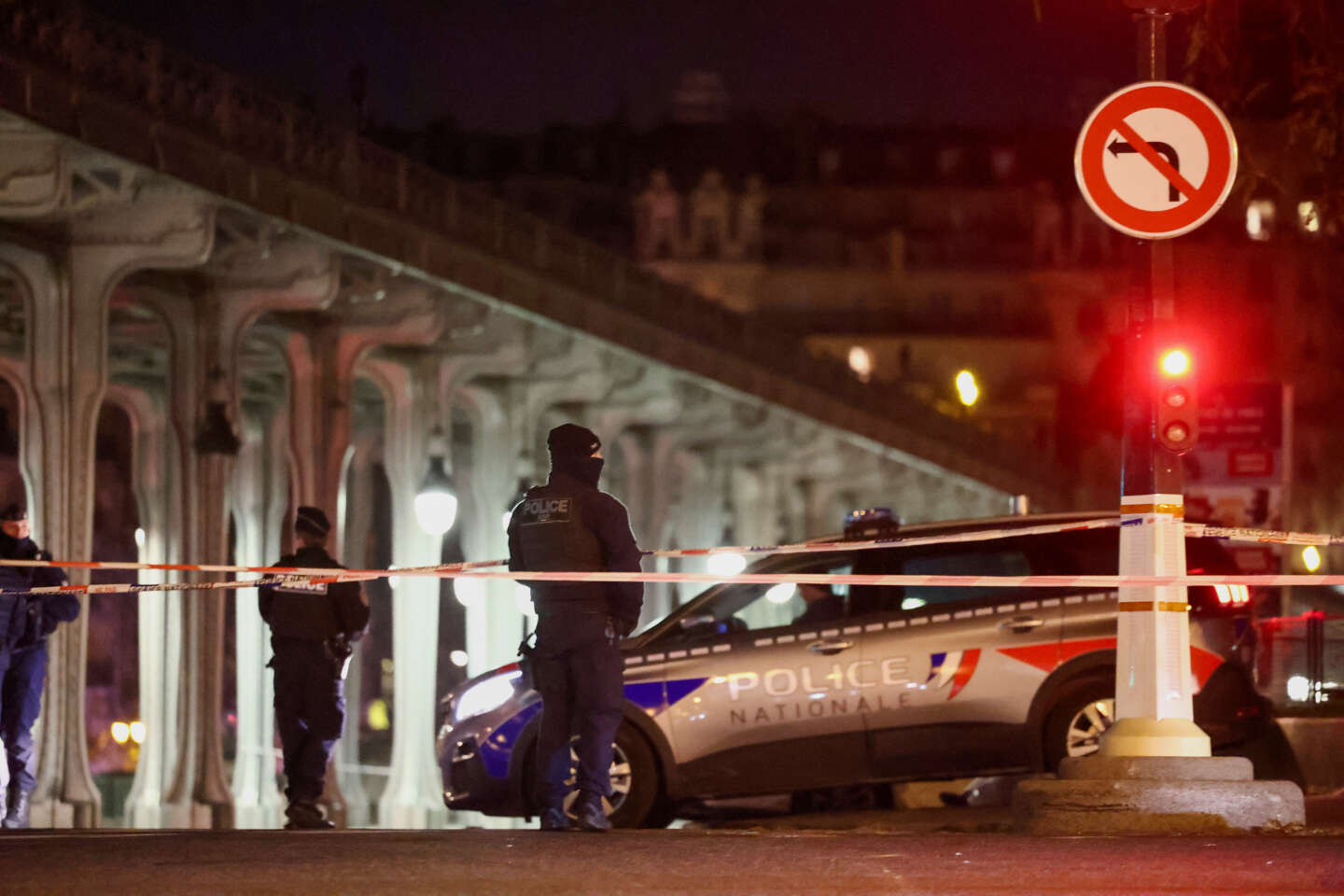 French police secure access to the Bir-Hakeim bridge after a security incident in Paris, France, on December 3, 2023.
