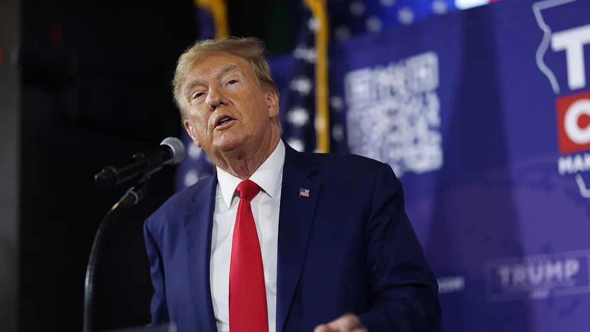 Republican presidential candidate former President Donald Trump speaks at a commit to caucus campaign event at the Whiskey River bar on Dec. 2 in Ankeny, Iowa.