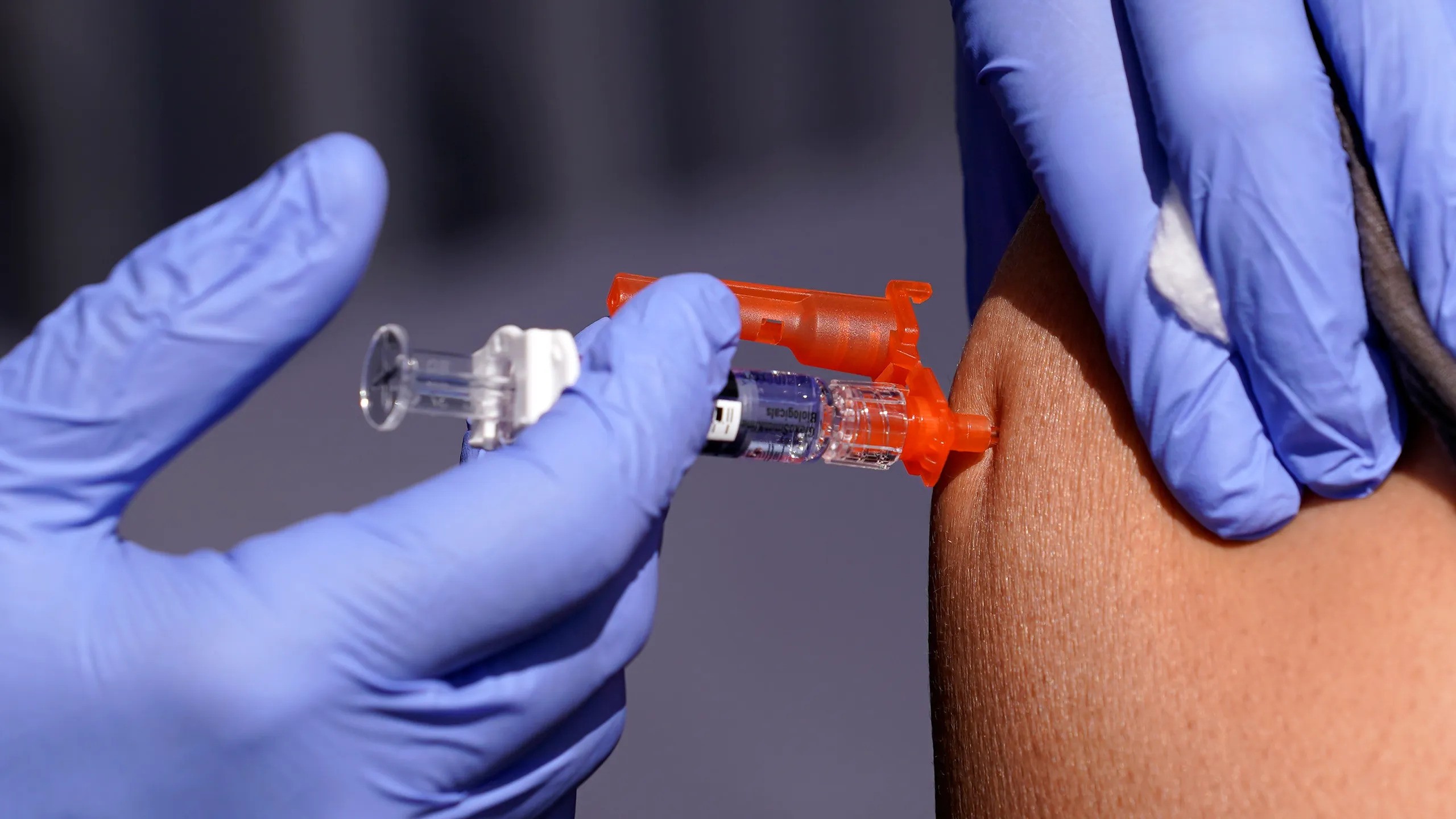 A person getting a vaccine shot