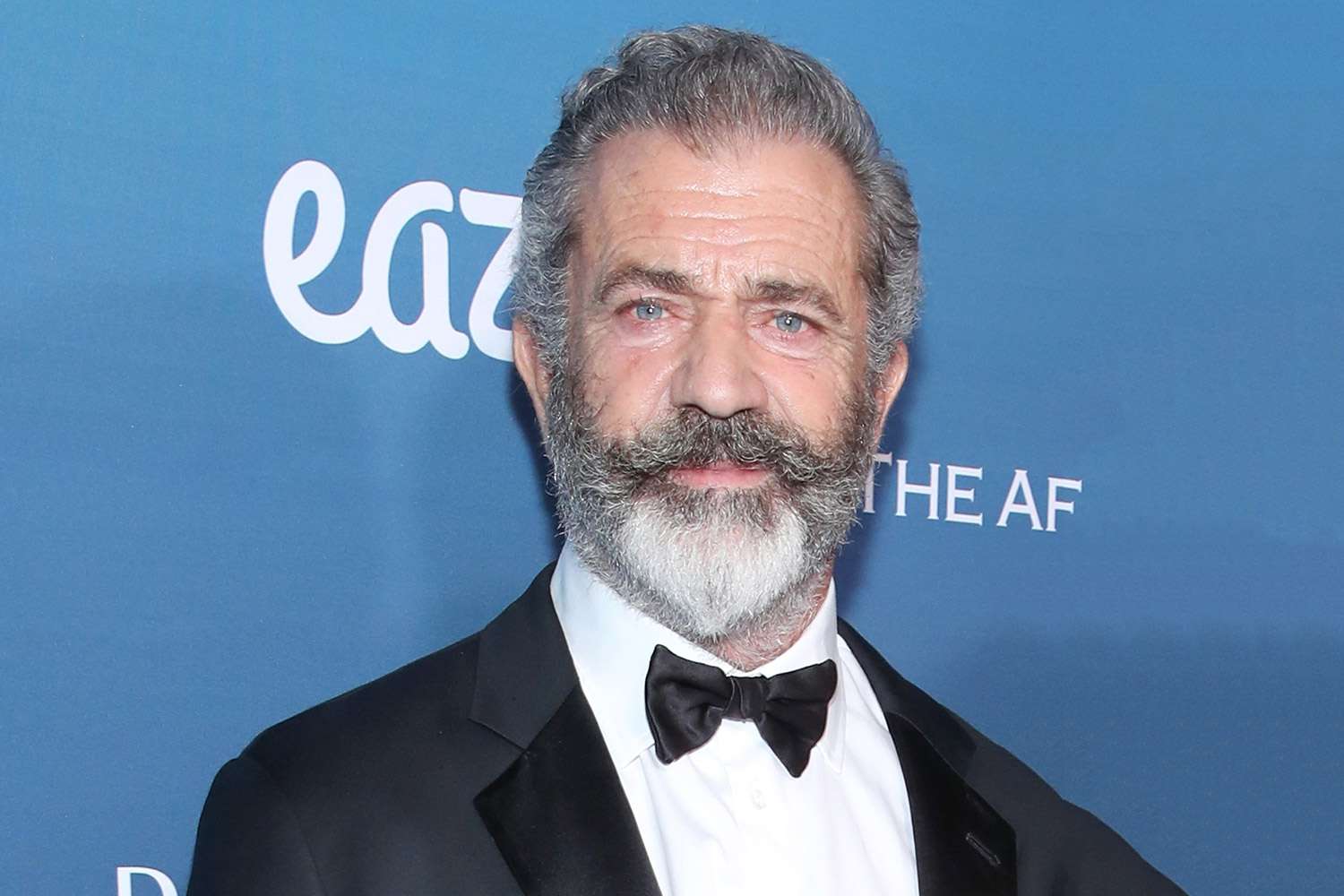Mel Gibson wearing a black suit