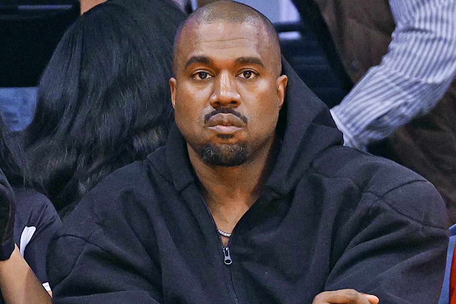 Kanye West wearing a black jacket