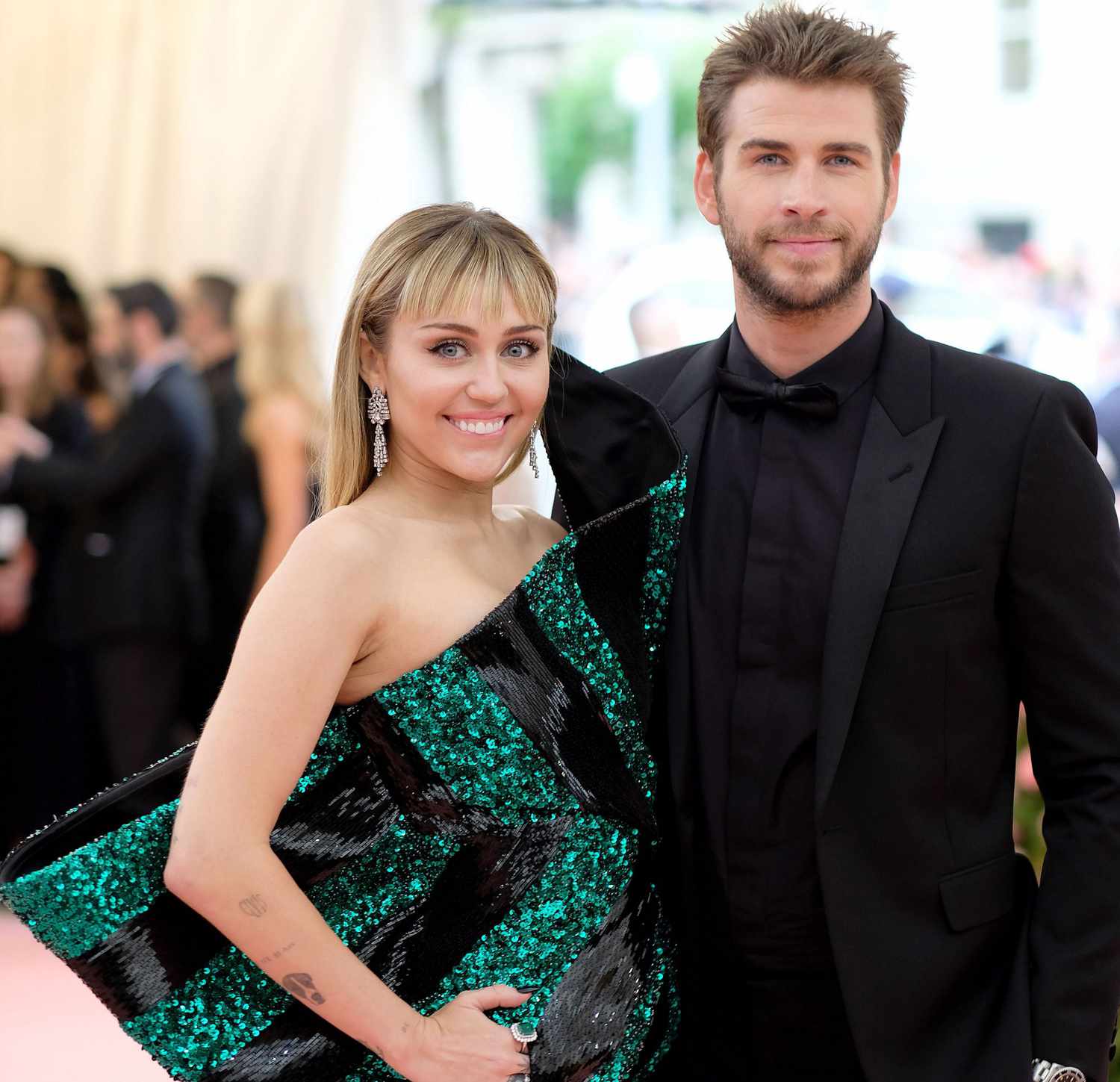 Liam Hemsworth and Miley Cyrus together.