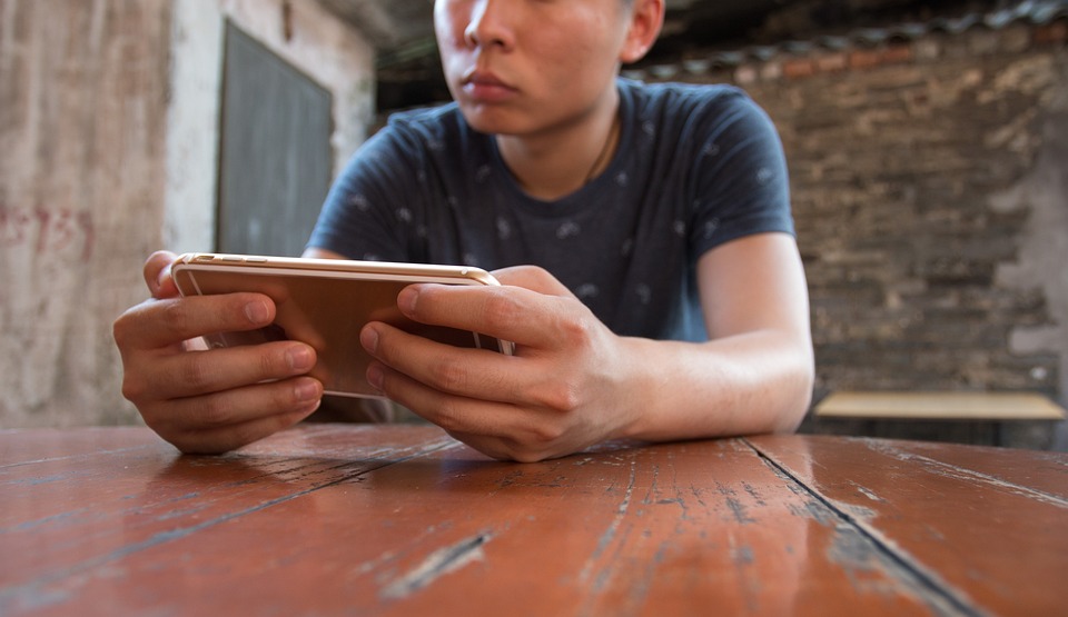 A man playing game on mobile