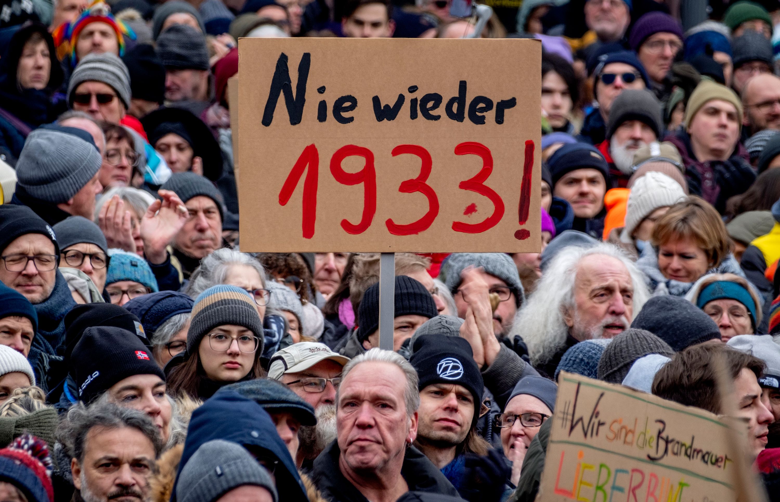 People protesting in Germany with placards