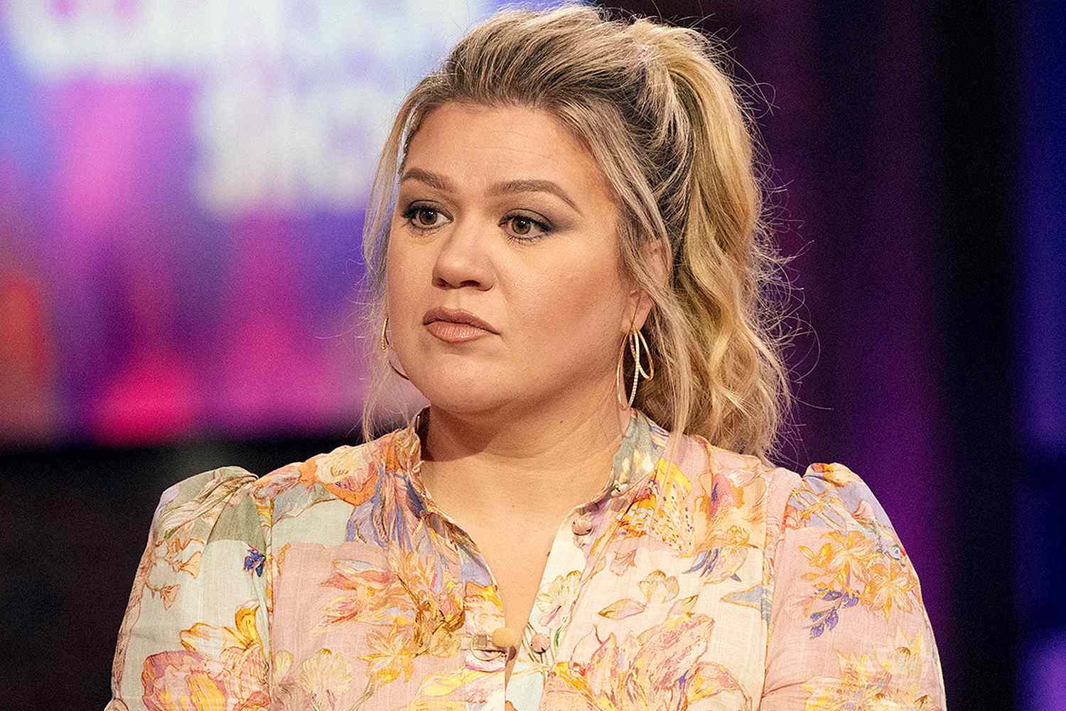 Kelly Clarkson wearing a floral dress on The Kelly Clarkson Show