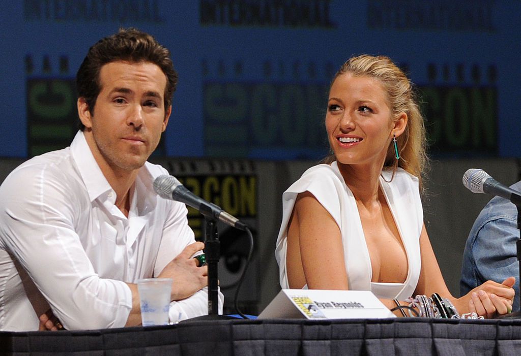 Ryan reynold wearing a white polo and Blake Lively wearing a white dress