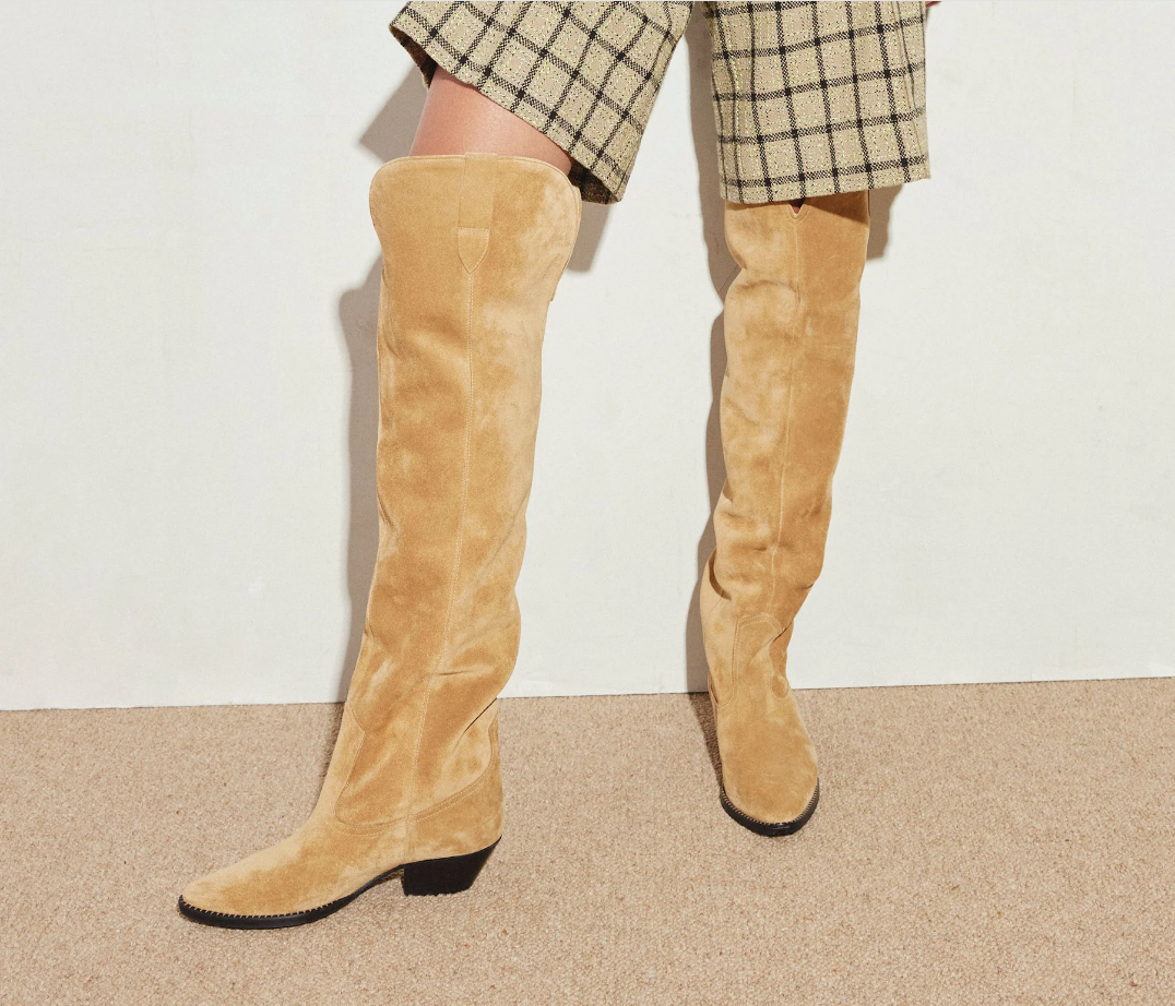 A girl wearing MOLLY Western Knee High Boot.