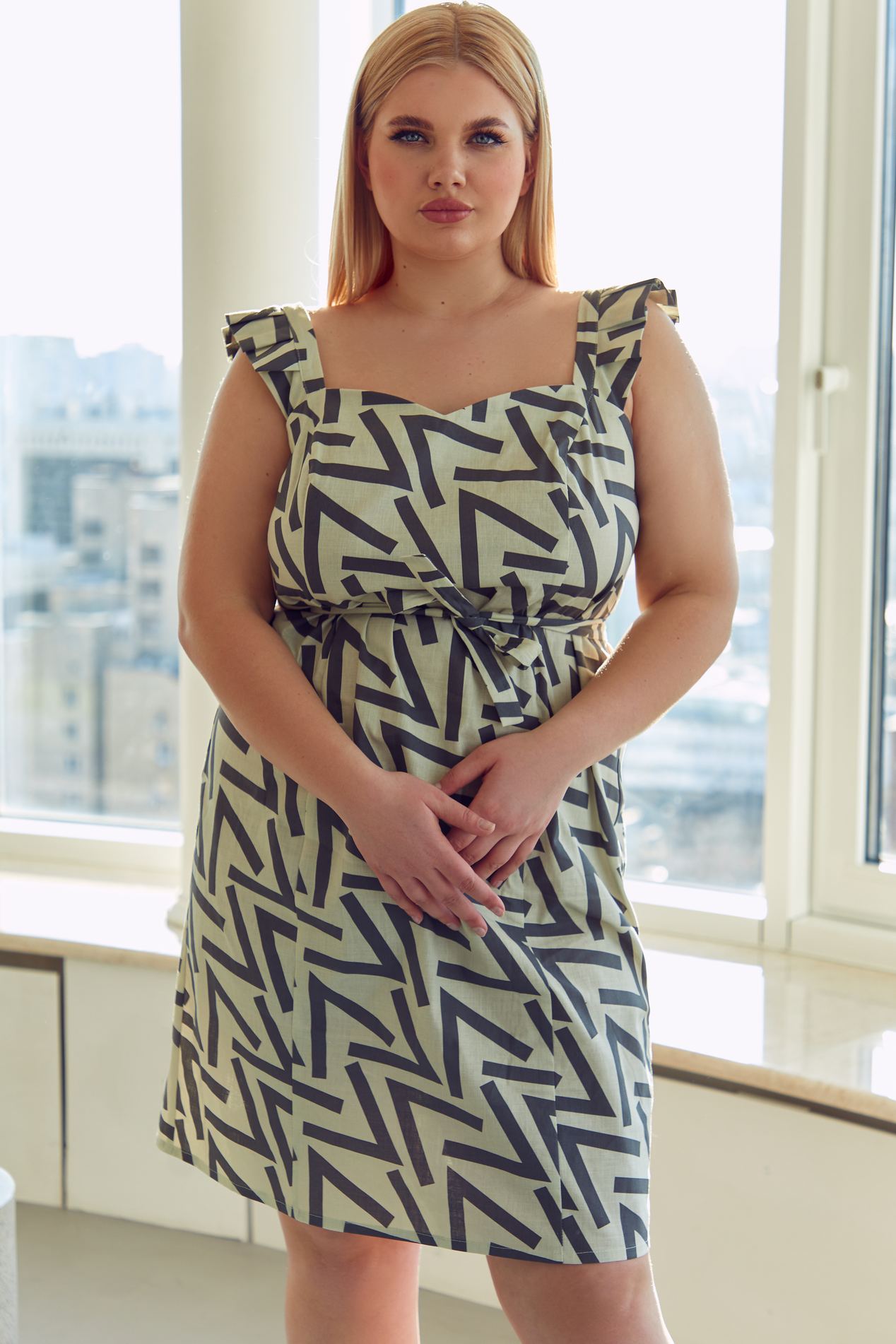 A woman wearing a pattern design dress