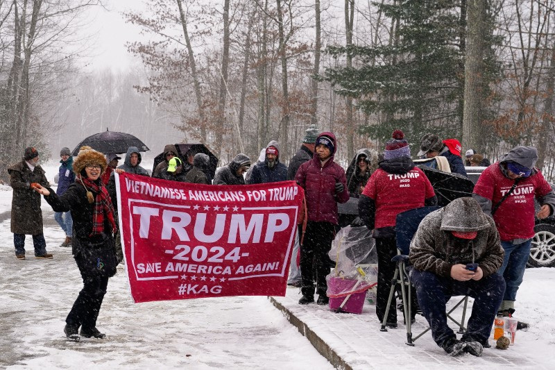 People wait in line before the start of a campaign rally with former U.S. President and Republican presidential candidate Donald Trump ahead of the New Hampshire primary election, in Atkinson, New Hampshire, U.S. January 16, 2024.
