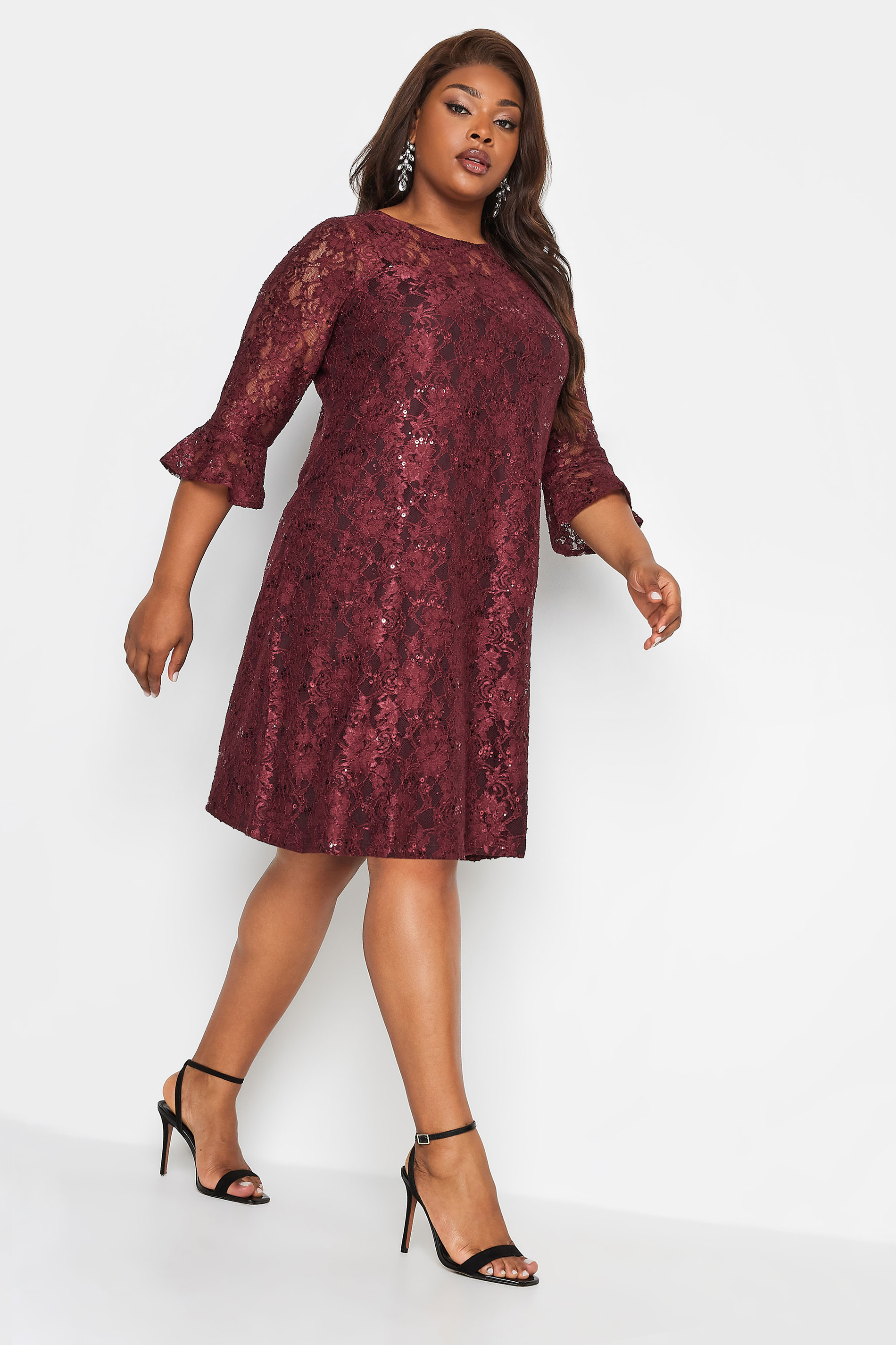 A woman wearing YOURS Curve Burgundy Red Lace Sequin Embellished Swing Dress