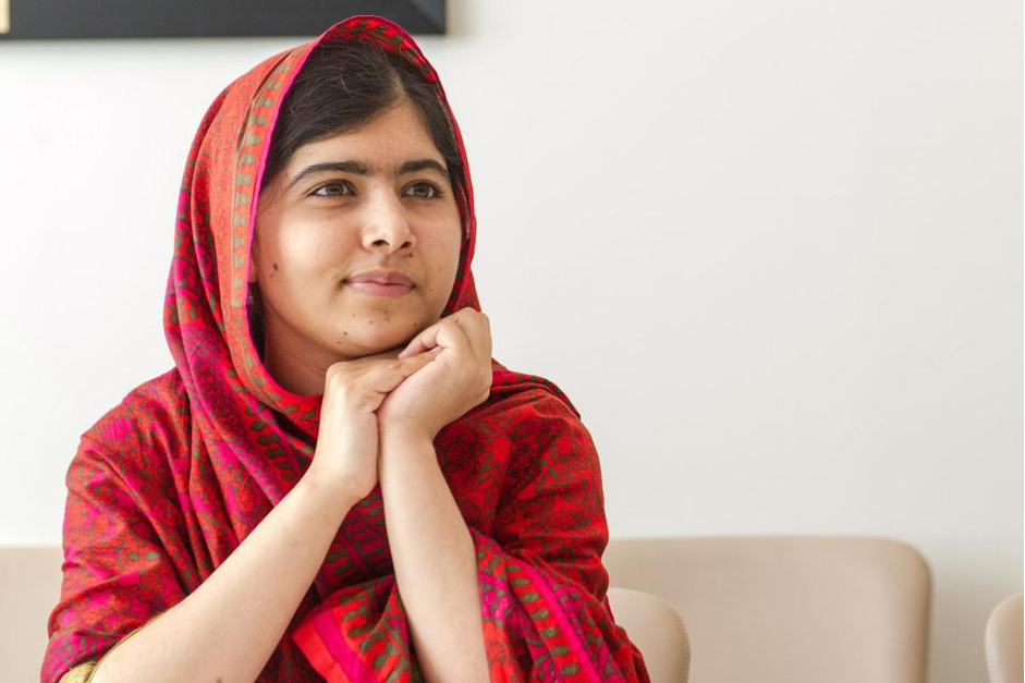 Malala Yousafzai wearing a red sari dress