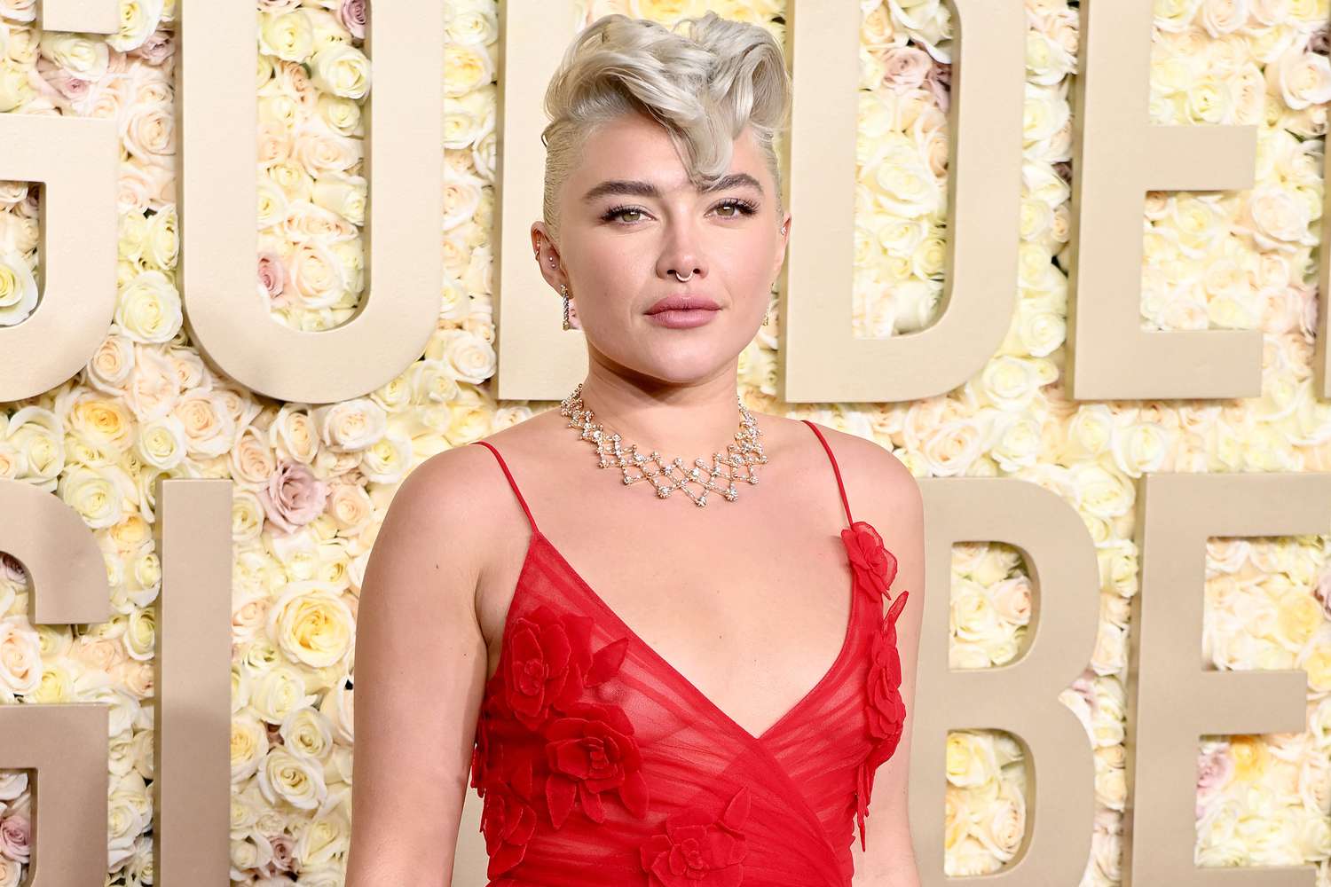 Florence Pugh wearing a red dress