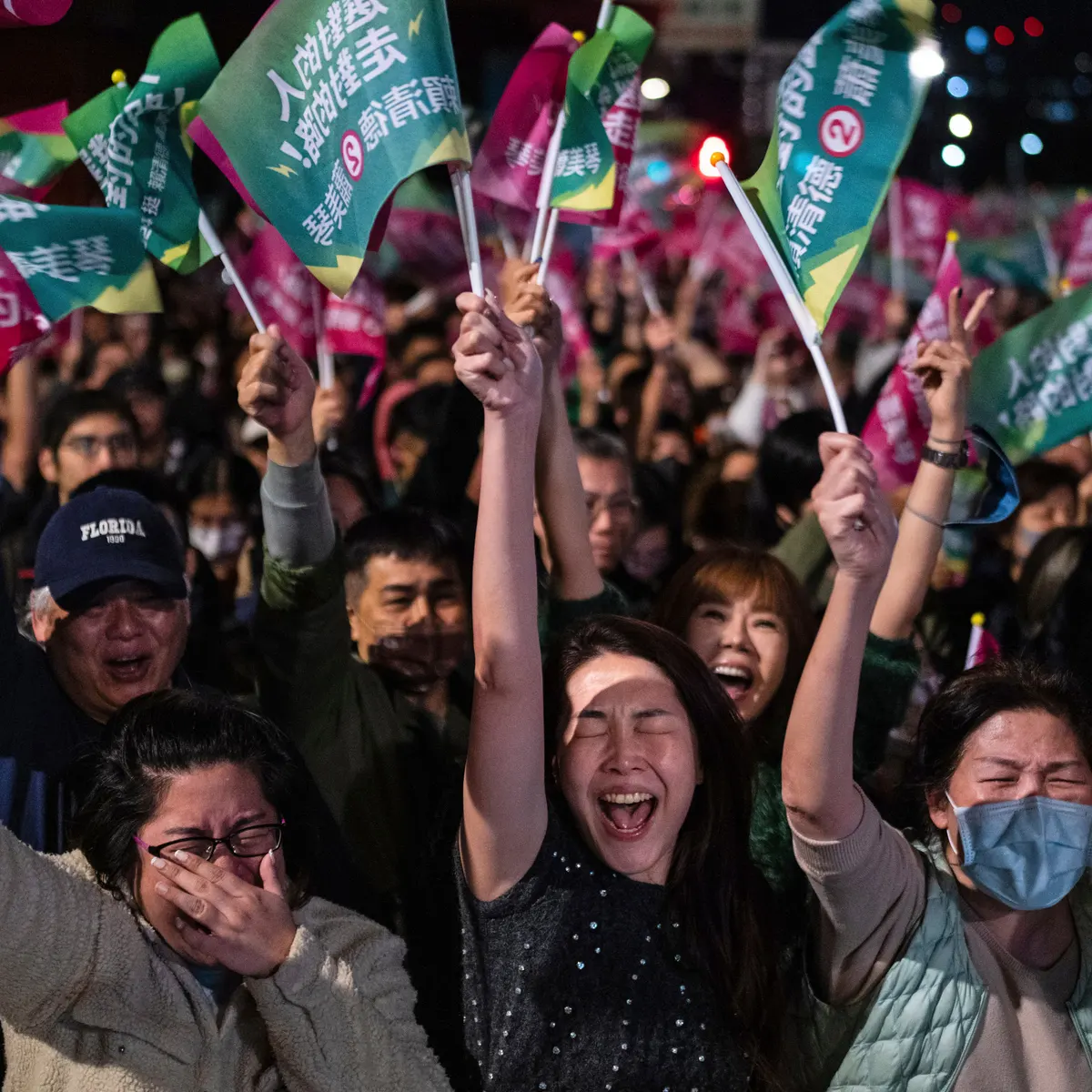 People cheer at a Democratic Progressive party rally in Taipei after ruling DPP party candidate Lai Ching-te won Saturday’s election.