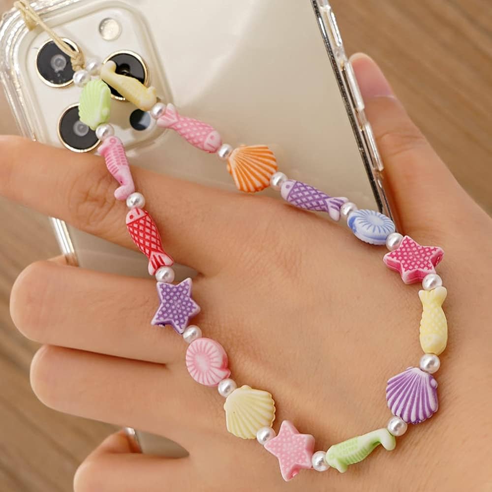 A multi color phone charm attached to a phone