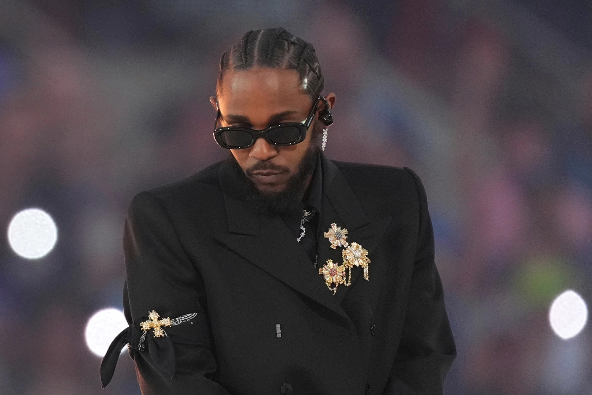 Kendrick Lamar wearing a black suit