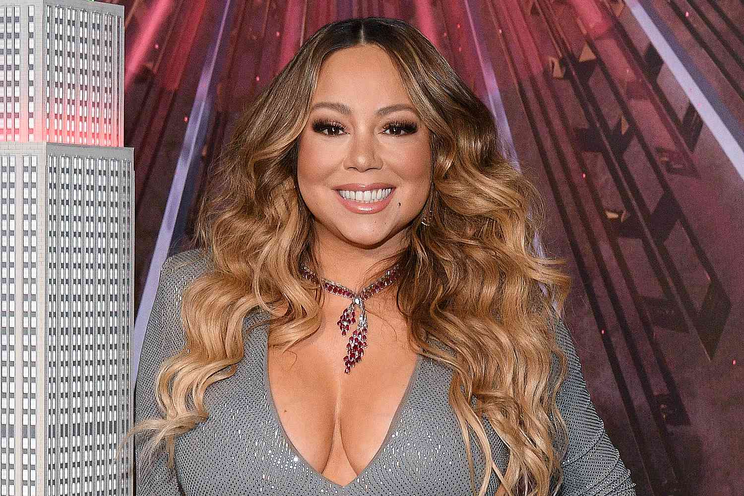 Mariah Carey wearing a gray dress