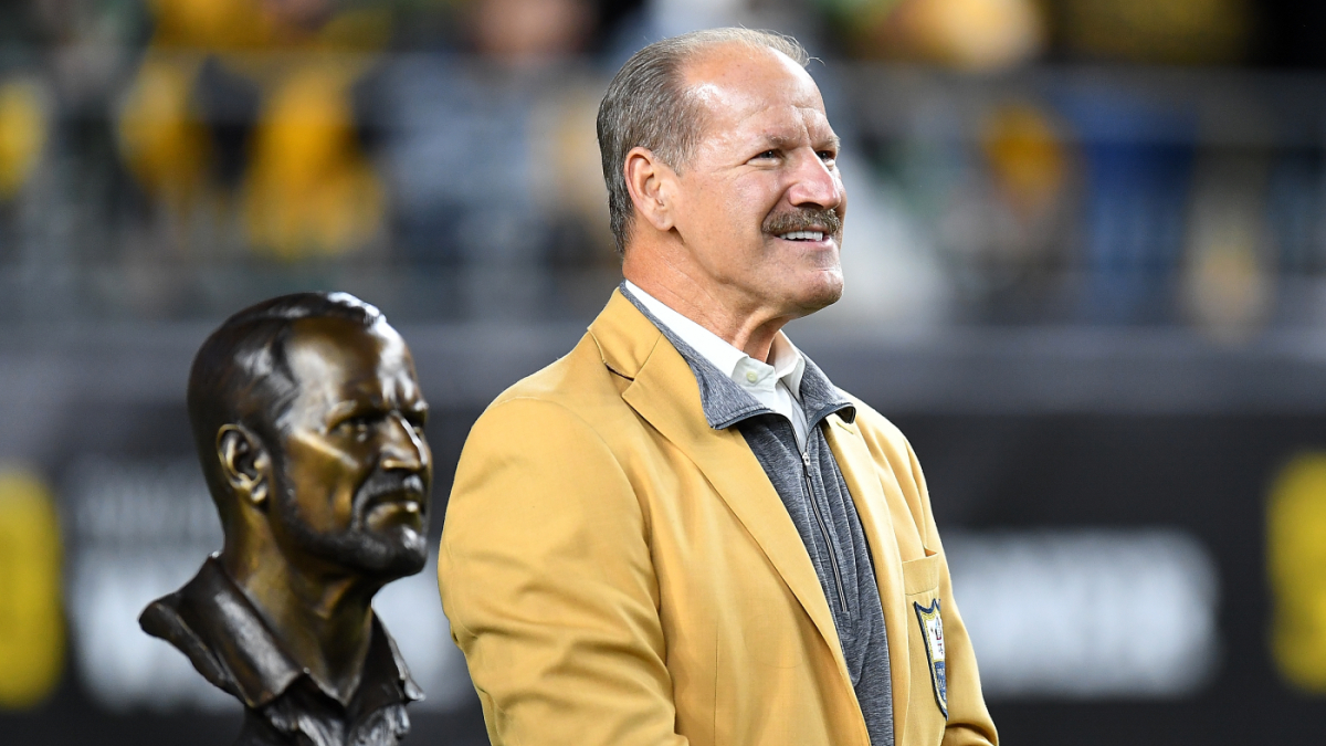 Bill Cowher wearing a yellow suit