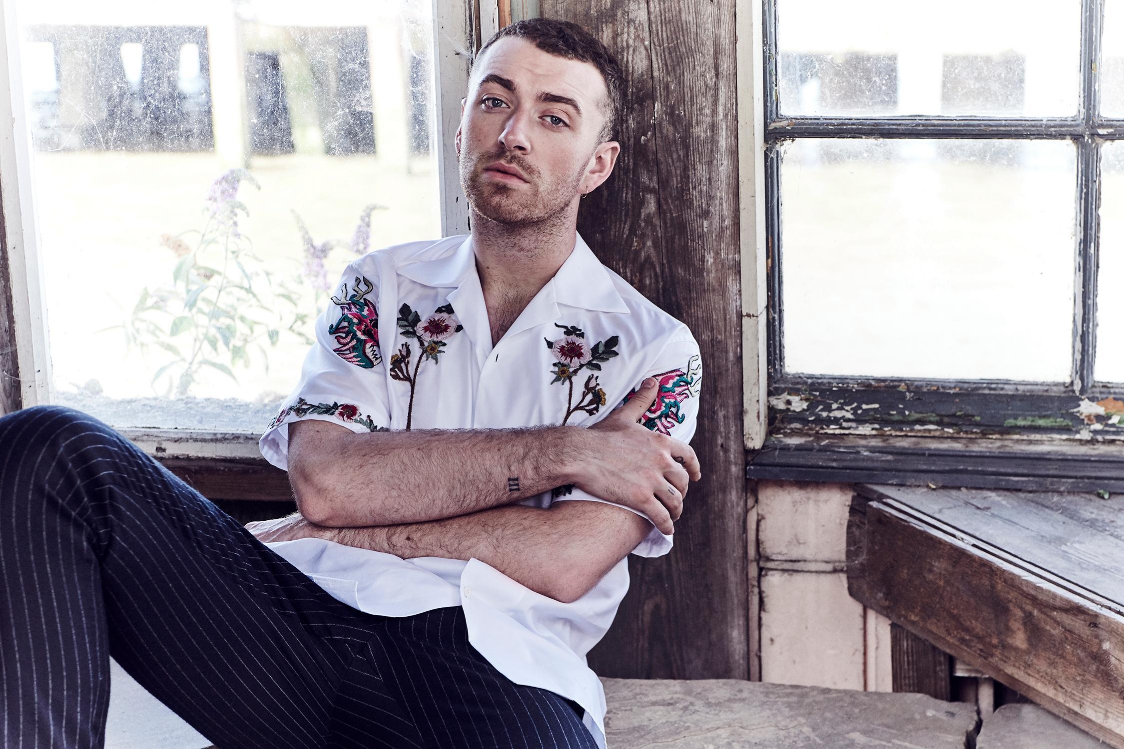 Sam Smith wearing a white floral polo