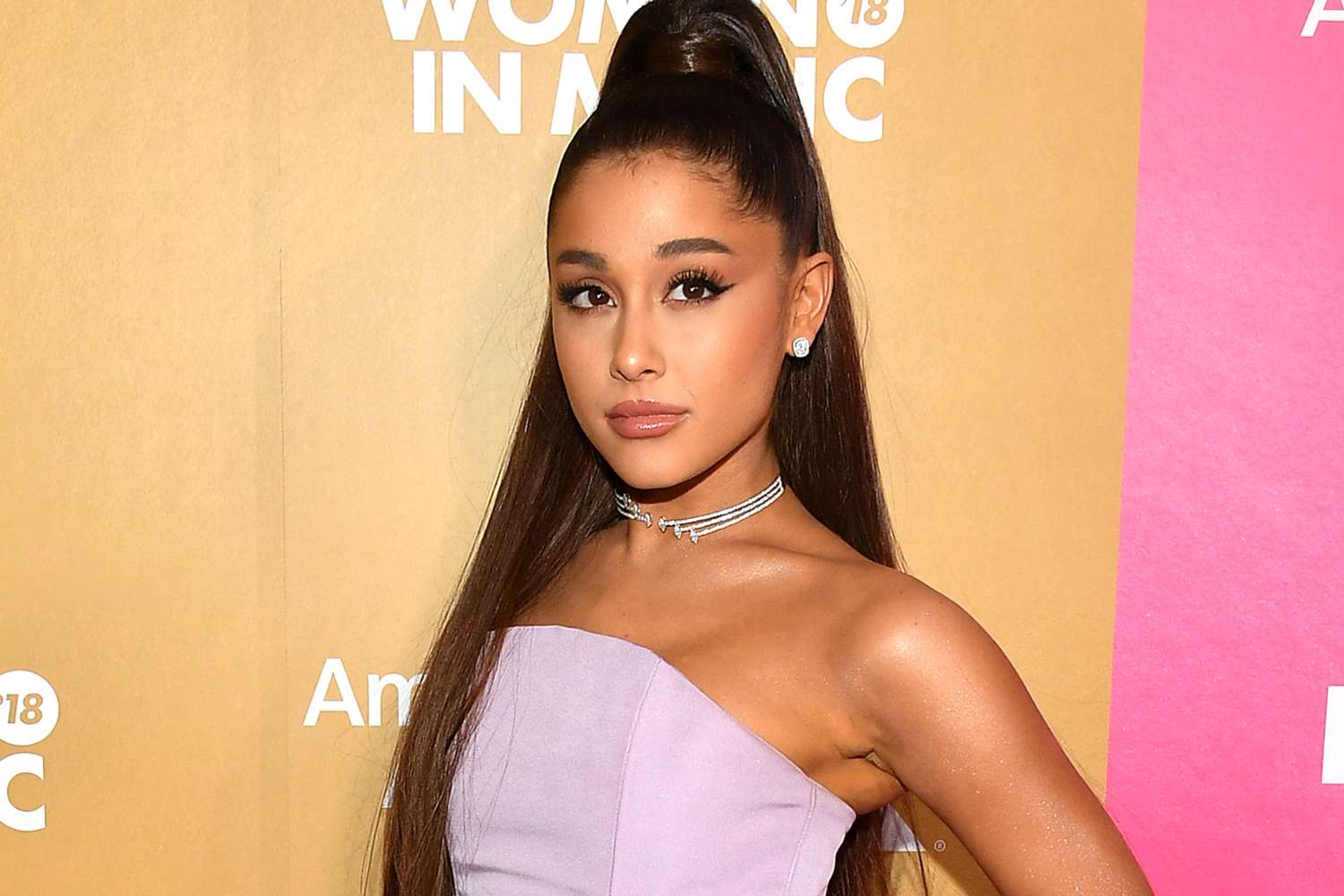 Ariana Grande wearing a purple dress