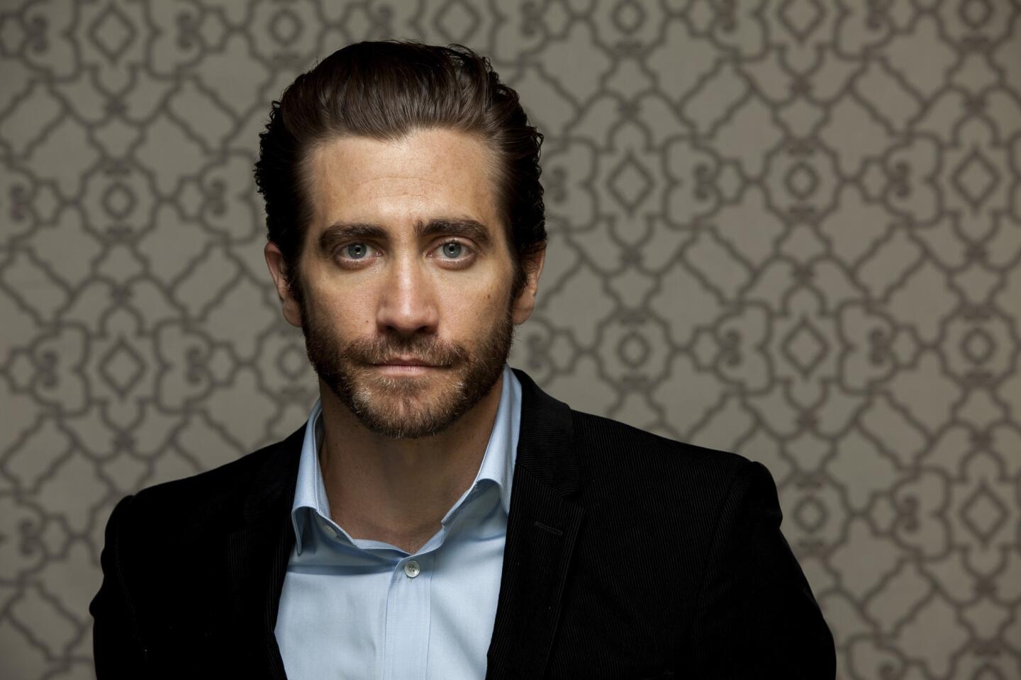 Jake Gyllenhaal wearing a black suit