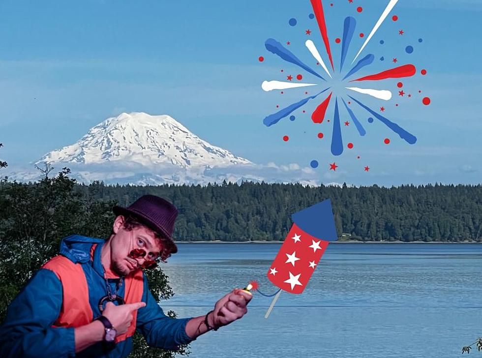 A man is enjoying fireworks near a lake.