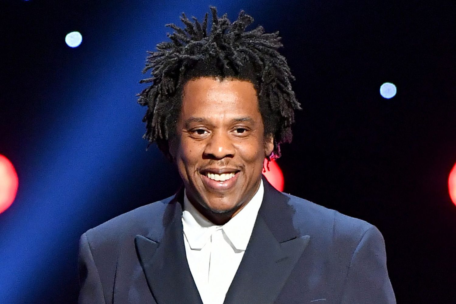 Jay-Z wearing a blue suit