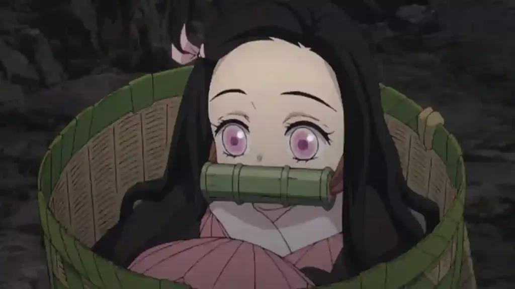 Nezuko Kamado inside a woven basket, likely used for her transport during daylight hours, still wearing her characteristic bamboo muzzle.