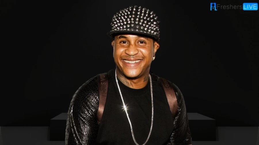 Orlando Brown wearing a necklace with a black dress.