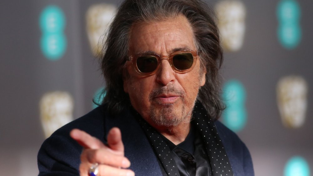 Al Pacino wearing a blue coat and sunglasses
