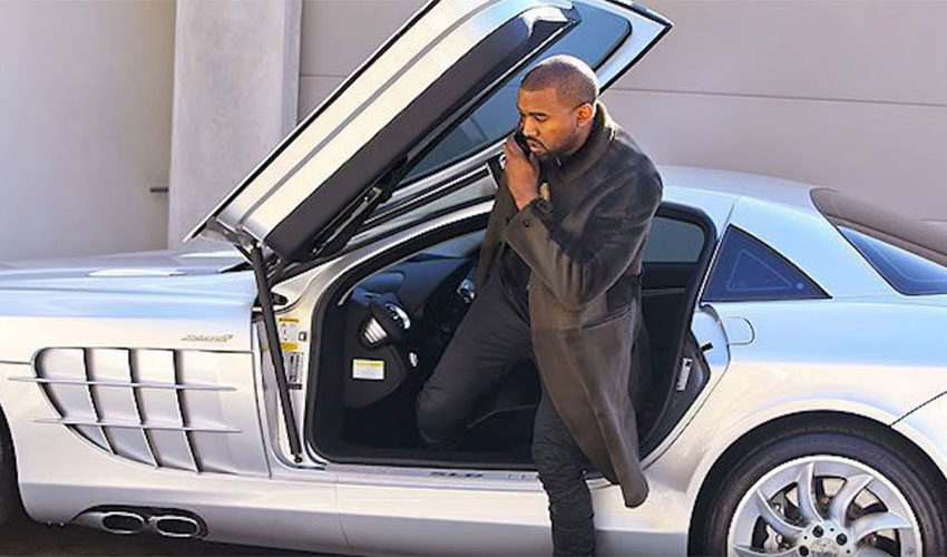 Kanye West getting out of his car