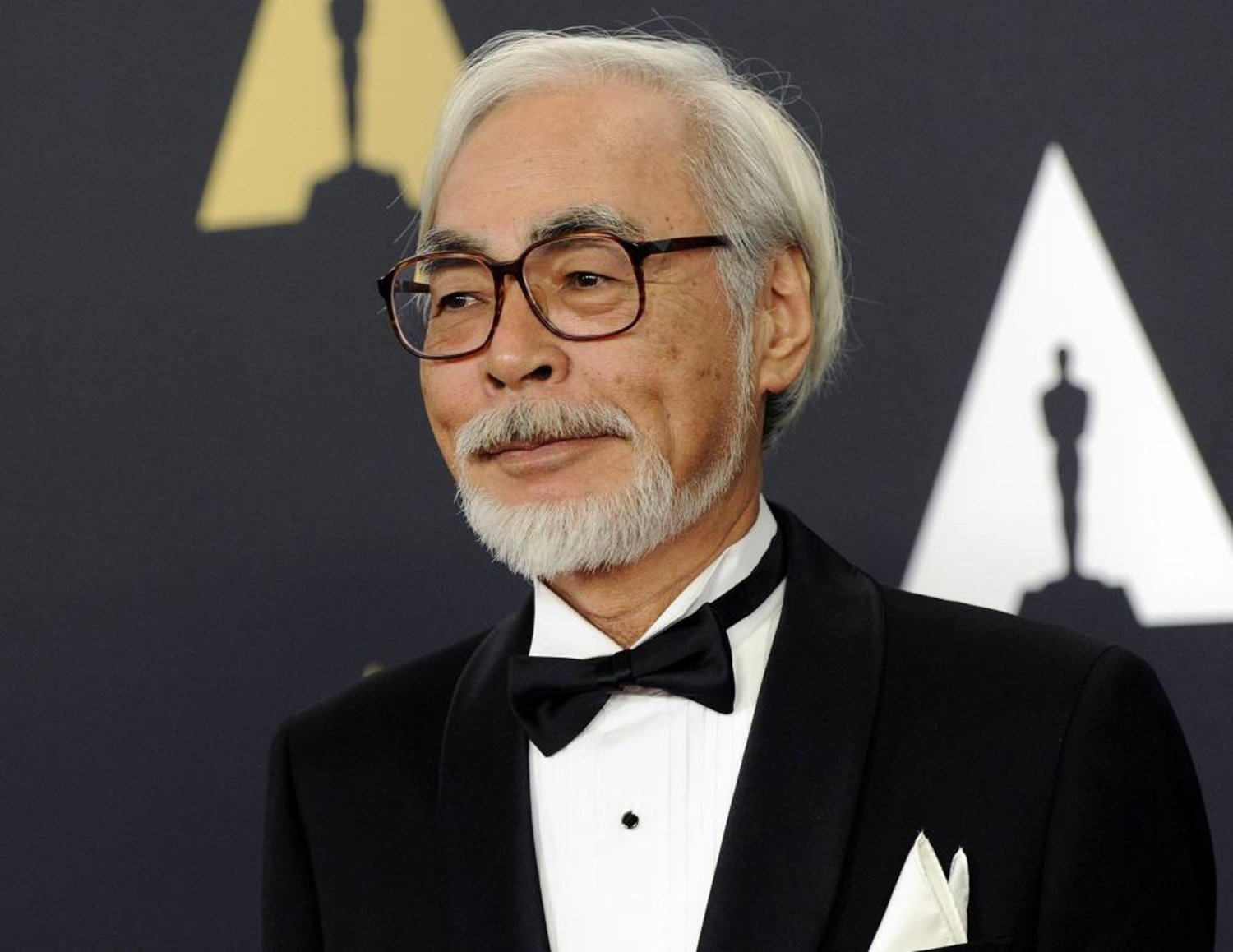 Hayao Miyazaki wearing a black suit