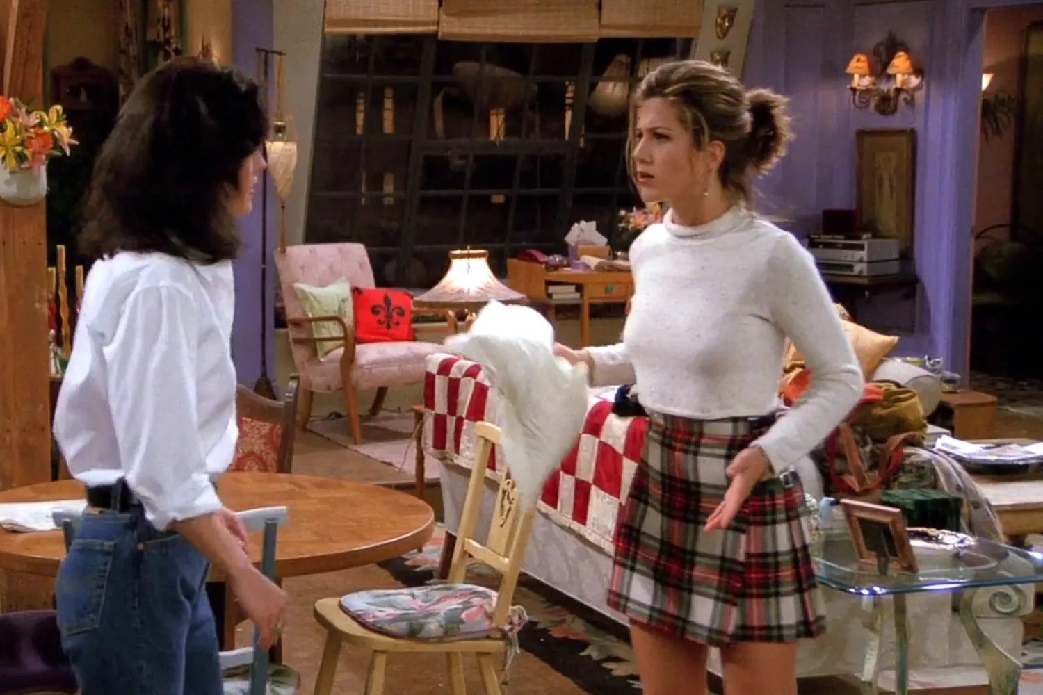 Rache Green in a white top and plaid skirt