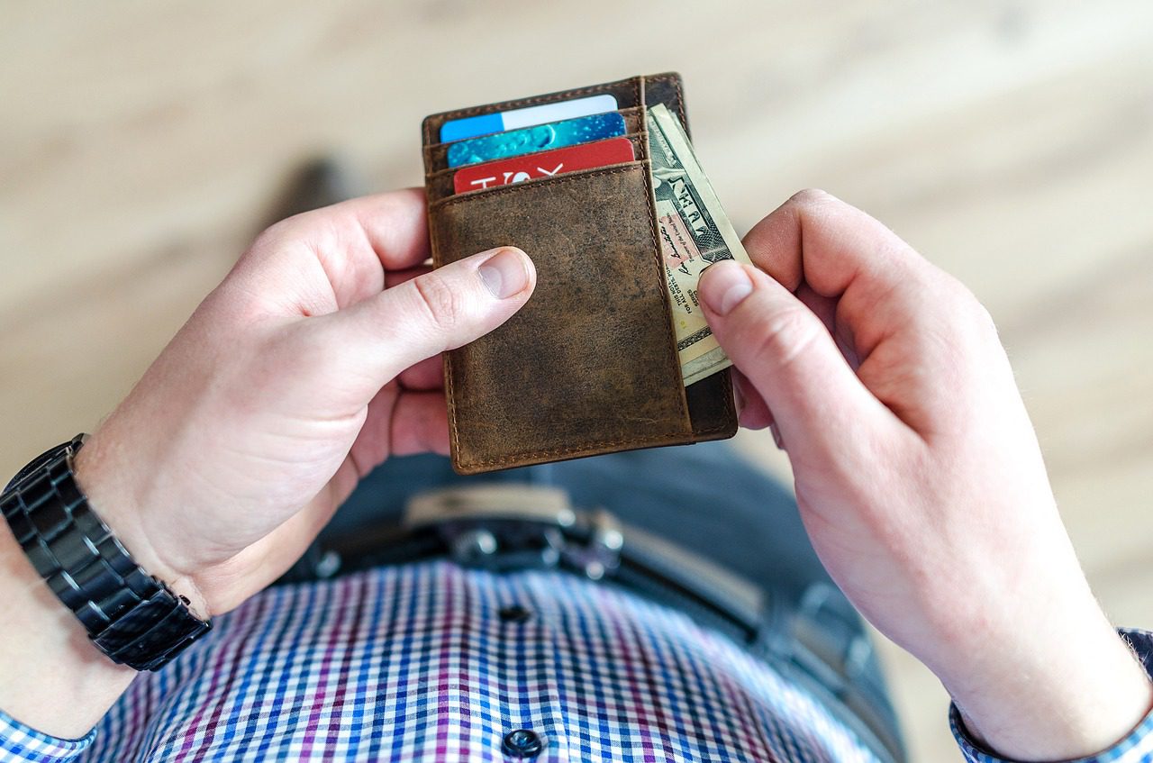 A man holding his wallet