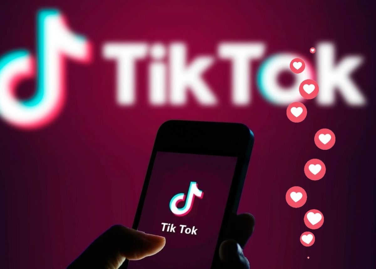A person holding a phone with the TikTok app open and getting a lot of likes.