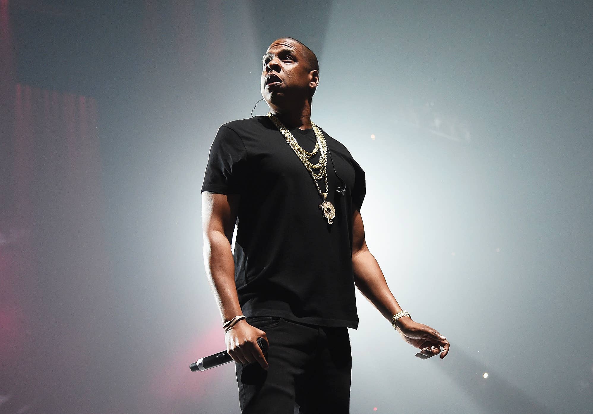 Jay-Z wearing a black shirt while holding a mic