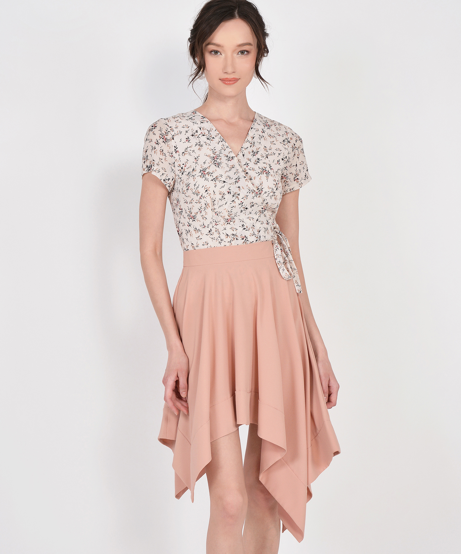 A girl wearing a peach asymmetrical skirt